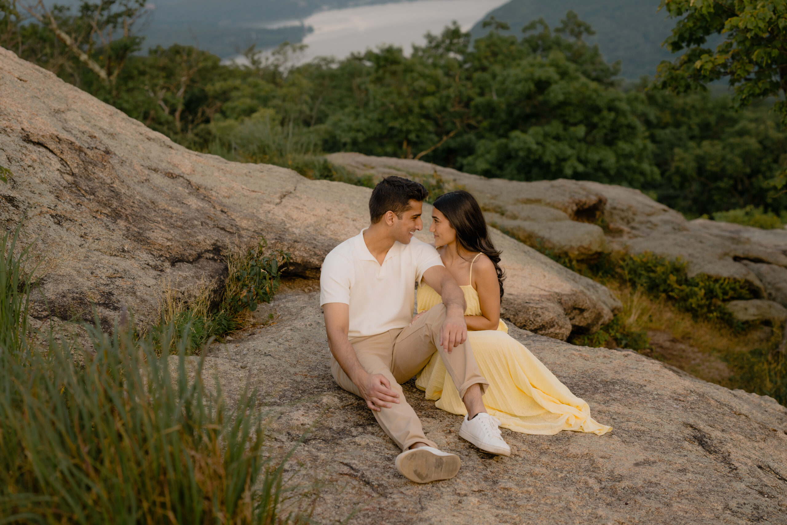 Couple sitting during their Romantic Bear Mountain Engagement Session