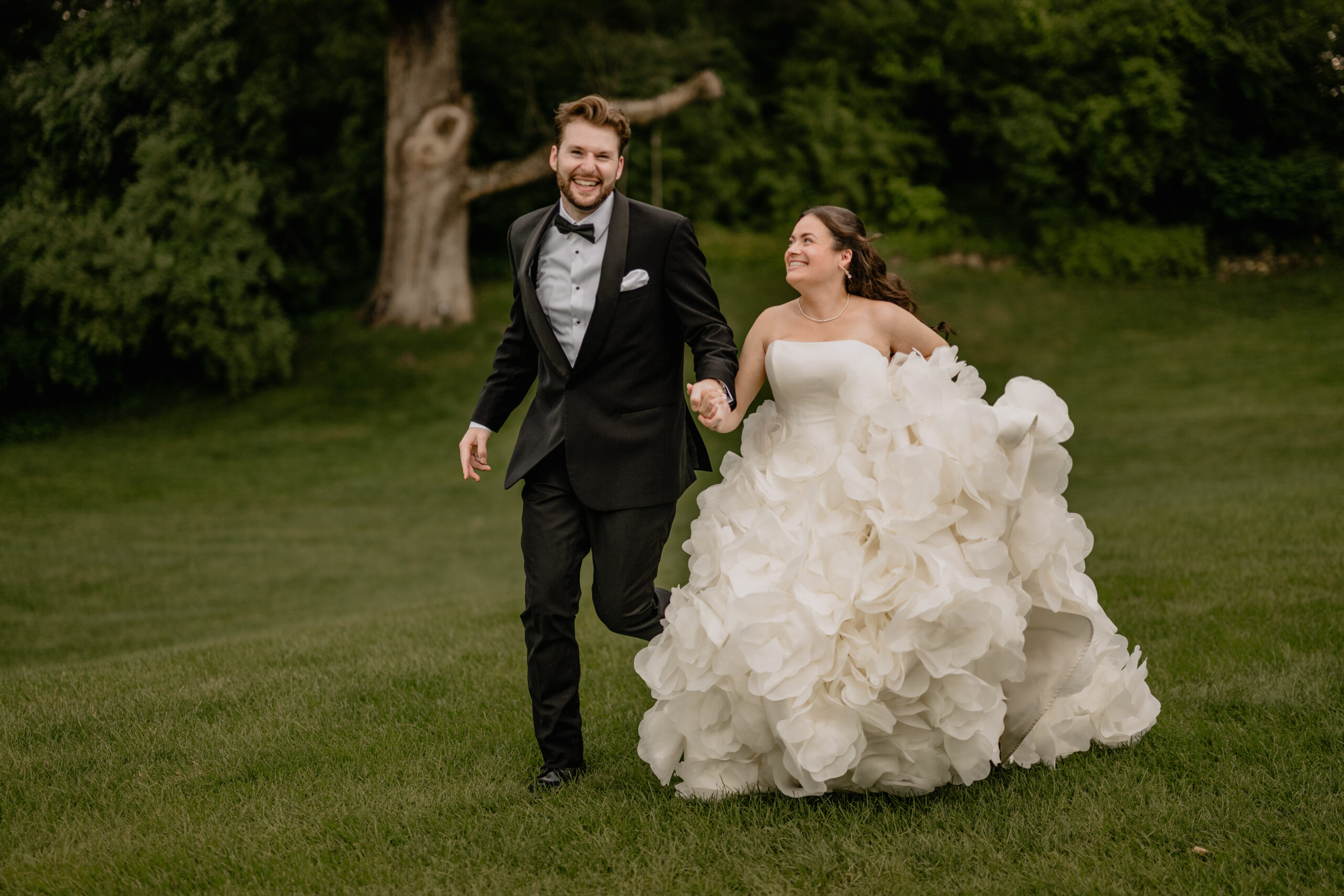Couple running while holding hands before their Beautiful Wedding at Crossed Keys Estate.