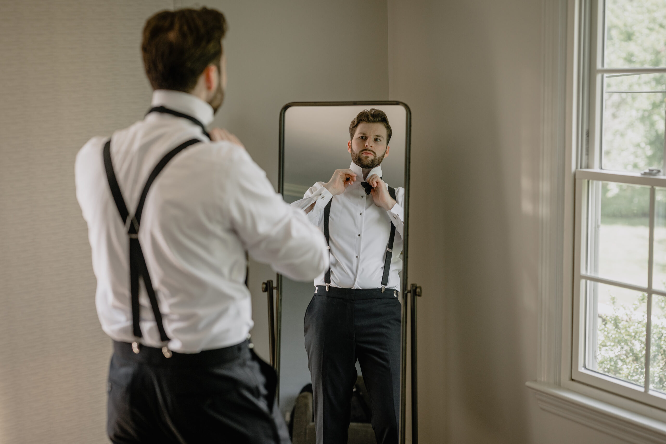 Groom getting ready before their Beautiful Wedding at Crossed Keys Estate.