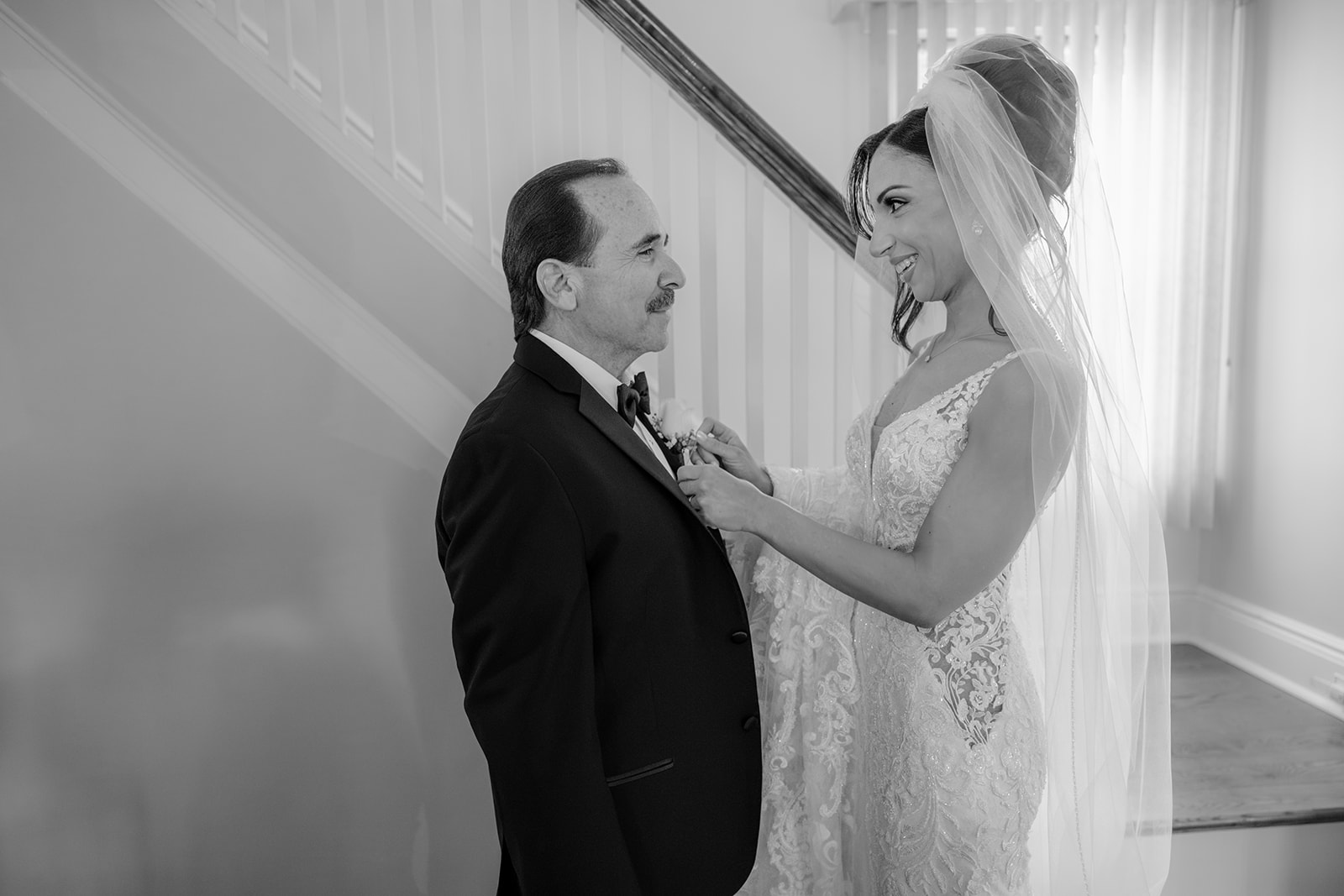 Bride fixing his father's suit before for their Wedding at Shadowbrook.