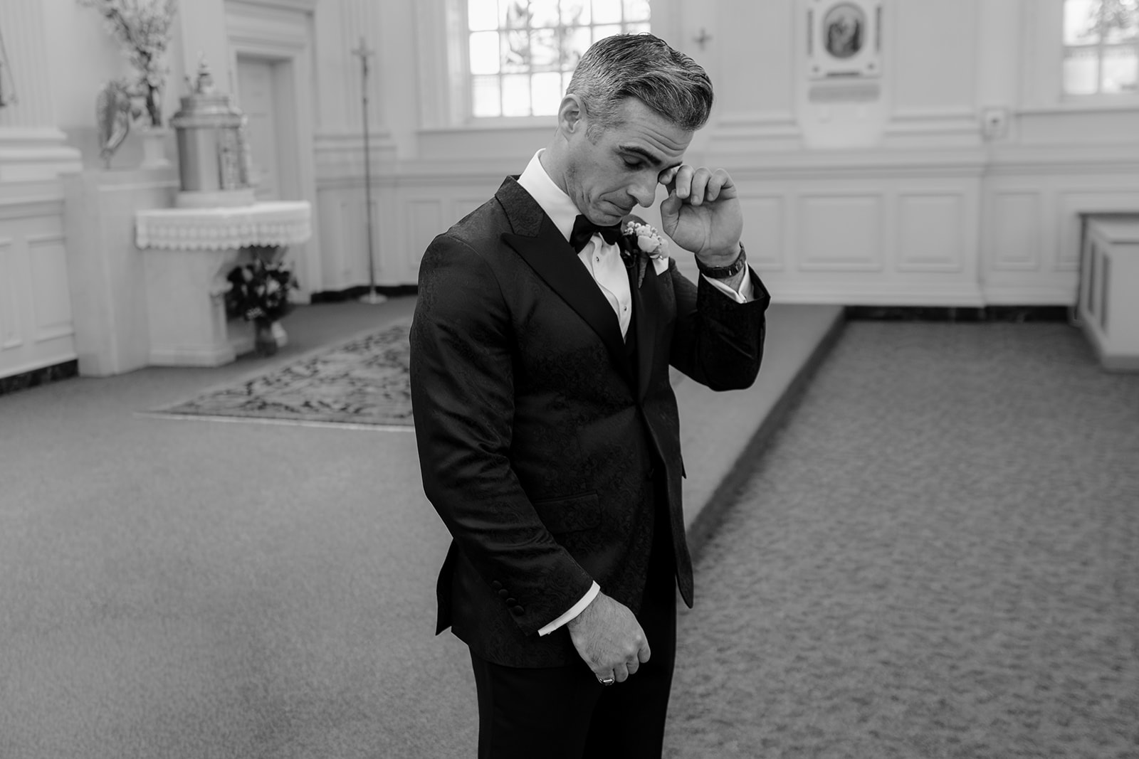 Groom wiping his tear at their Wedding at Shadowbrook.
