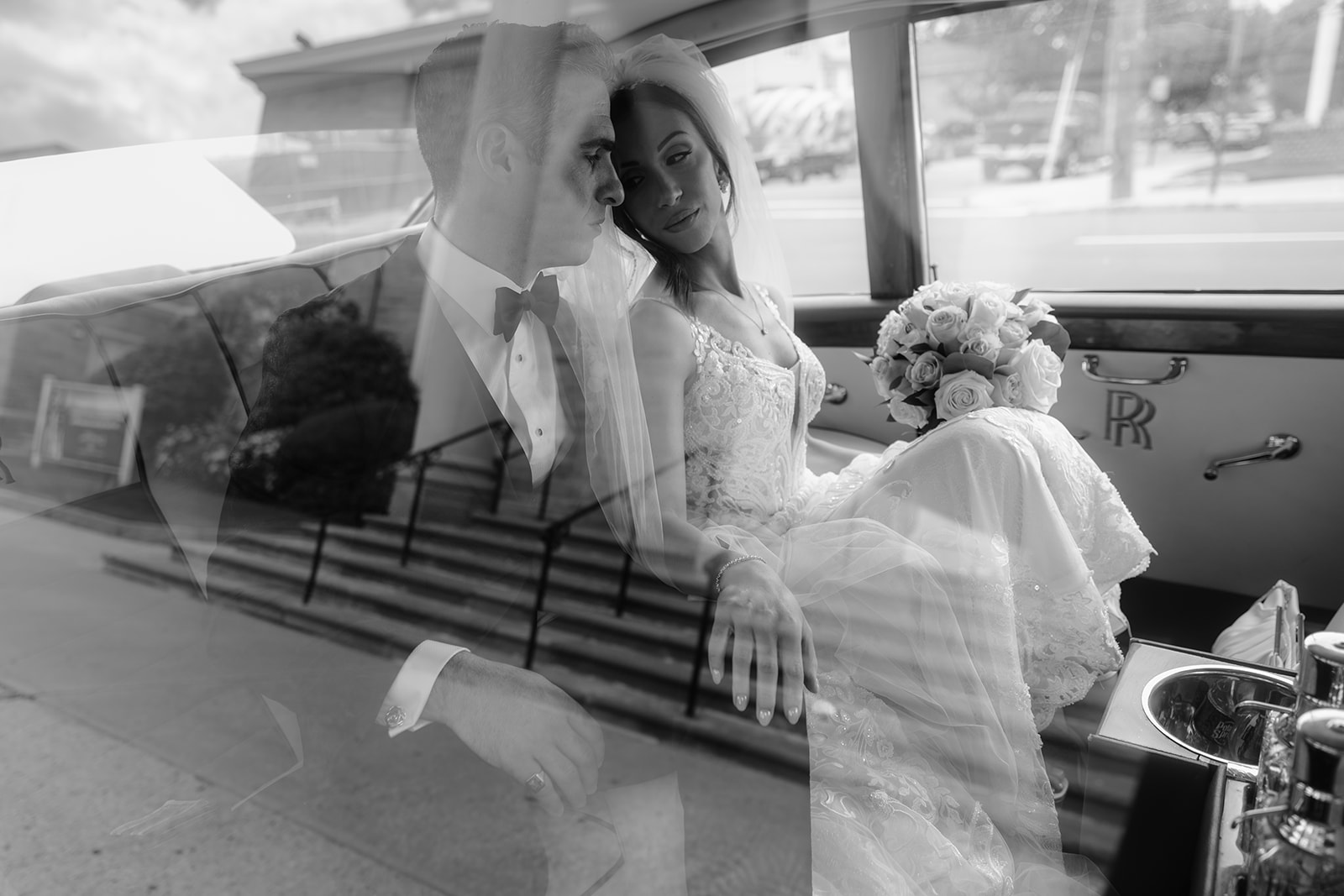 Couple inside the car at their Wedding at Shadowbrook. 