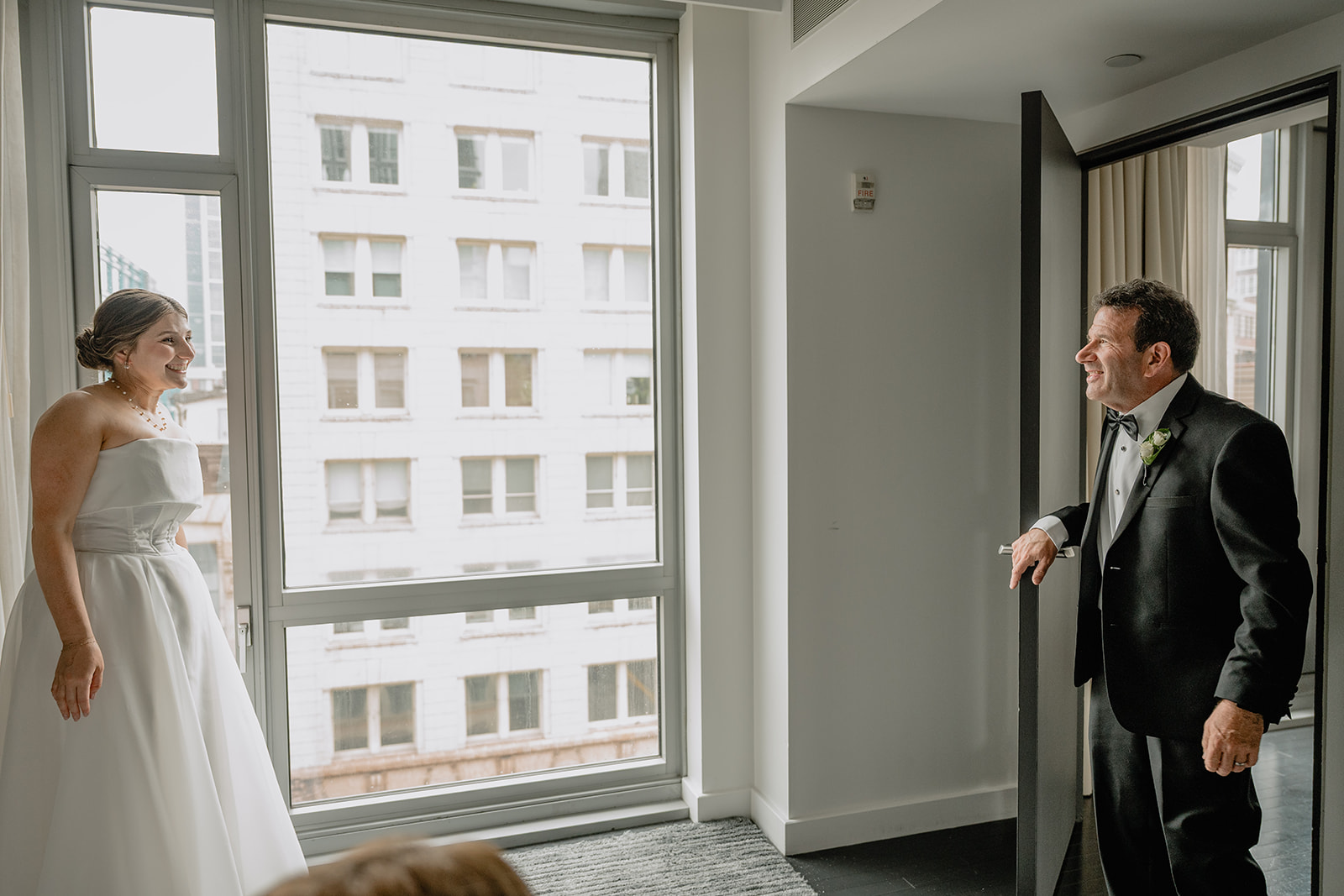 Bride's first look with her parent before their intimate wedding at Tribeca Rooftop