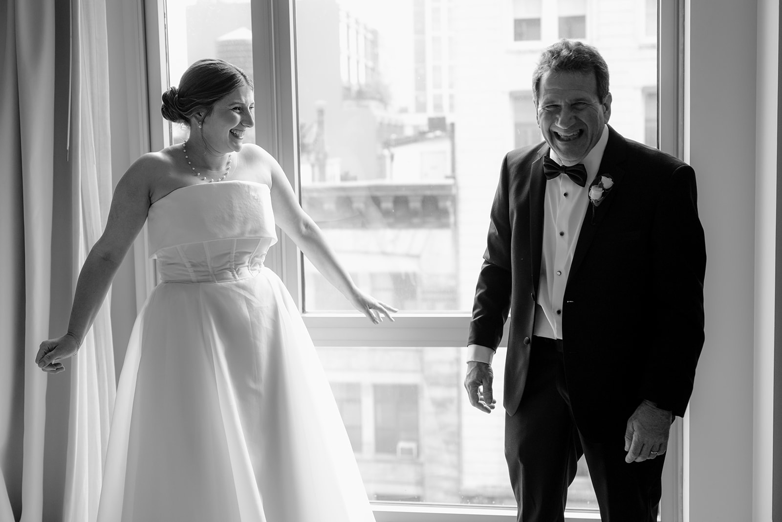 Bride's first look with her parent before their intimate wedding at Tribeca Rooftop
