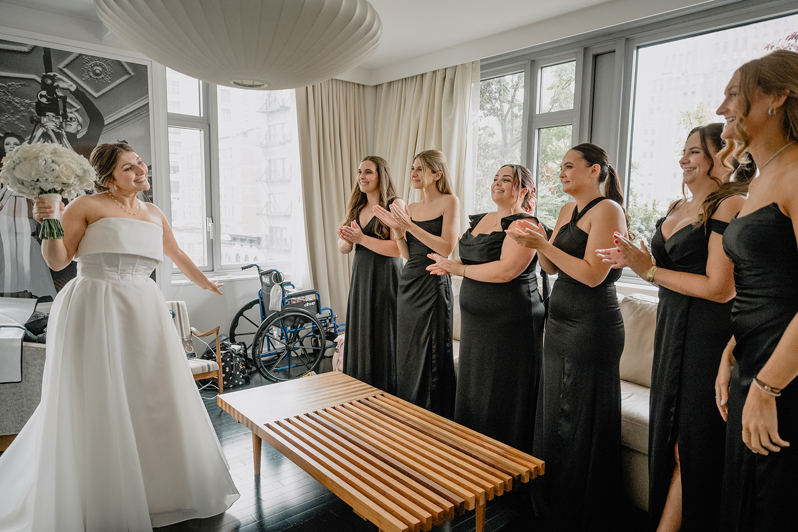 Bride's first look with her bridesmaids before their intimate wedding at Tribeca Rooftop