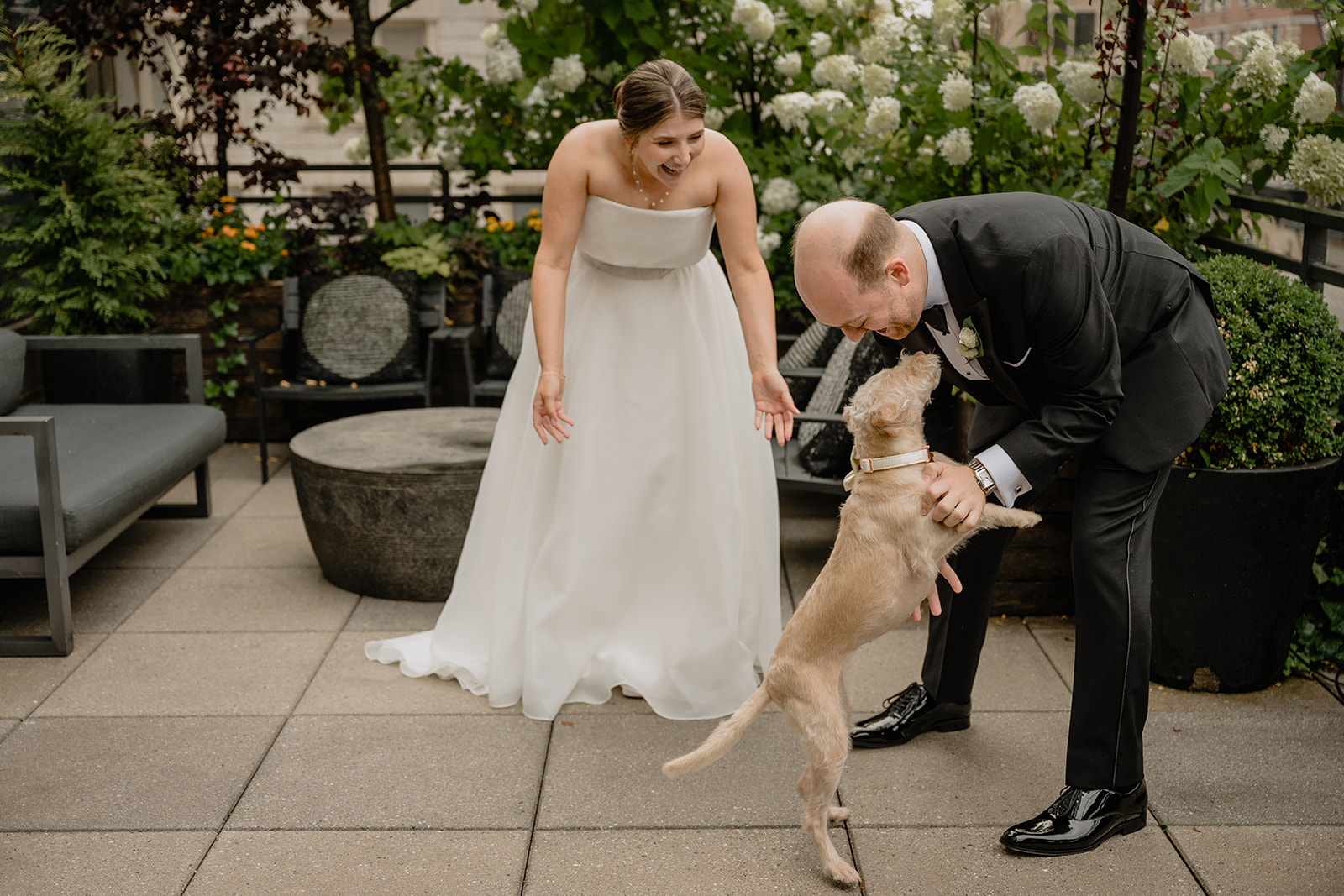 Couple with their fur baby before their intimate wedding at Tribeca Rooftop