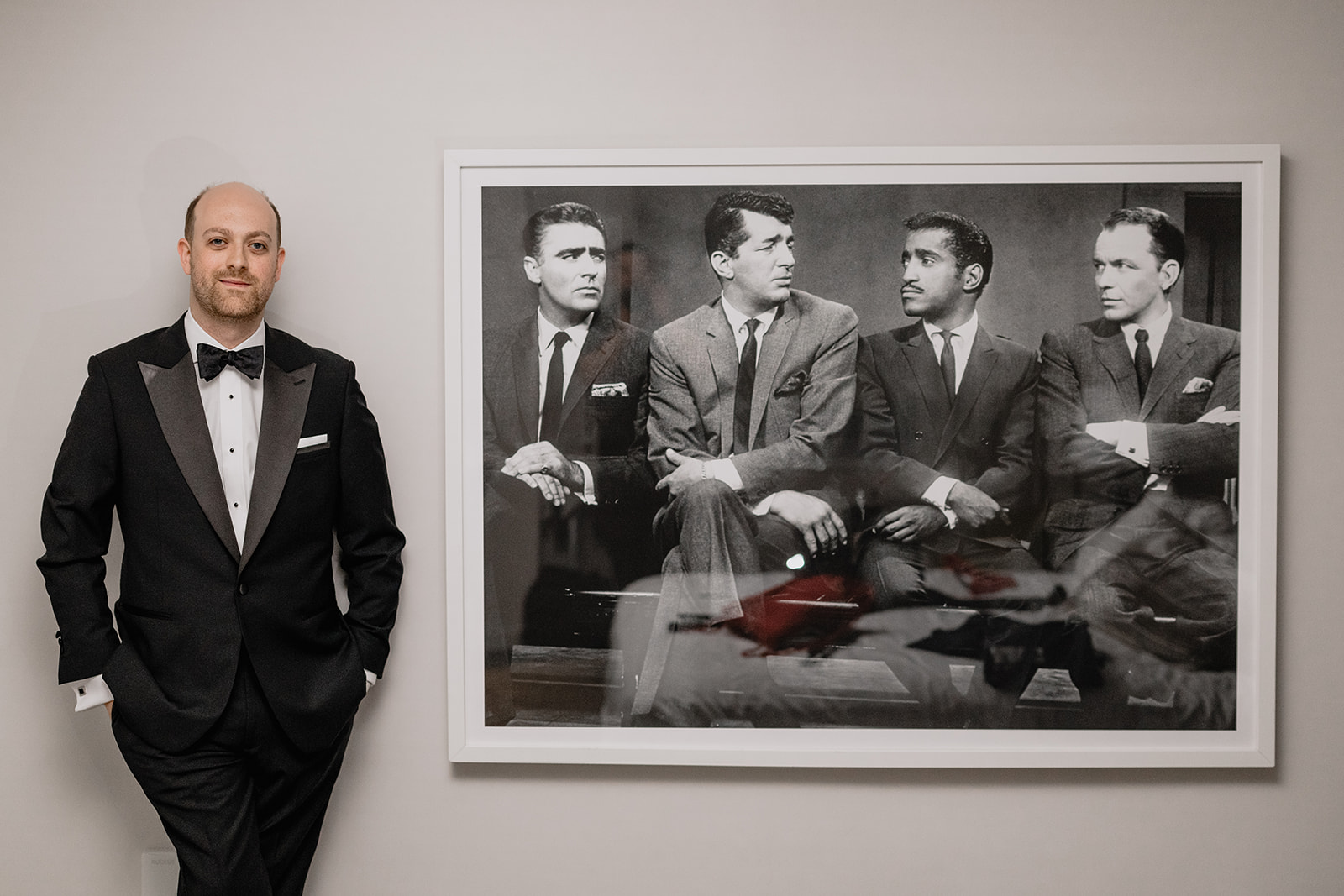 Groom's portrait by a photo before their intimate wedding at Tribeca Rooftop