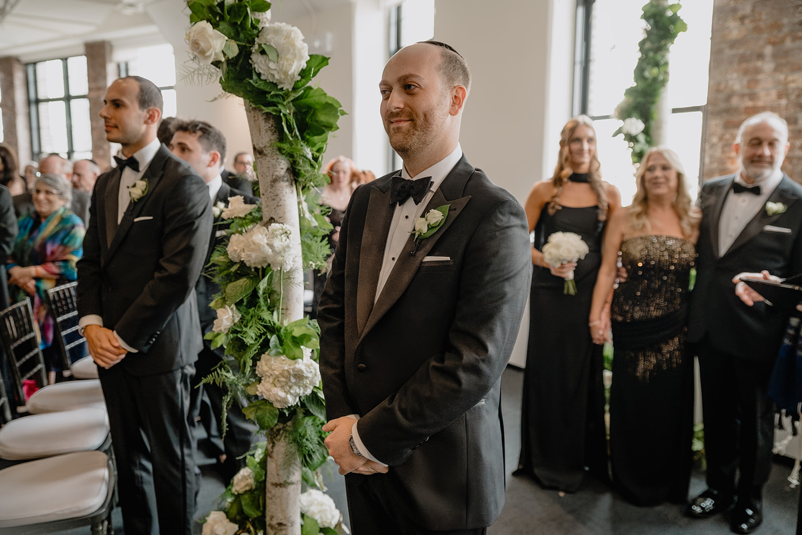 Groom waiting on the altar during their intimate wedding at Tribeca Rooftop