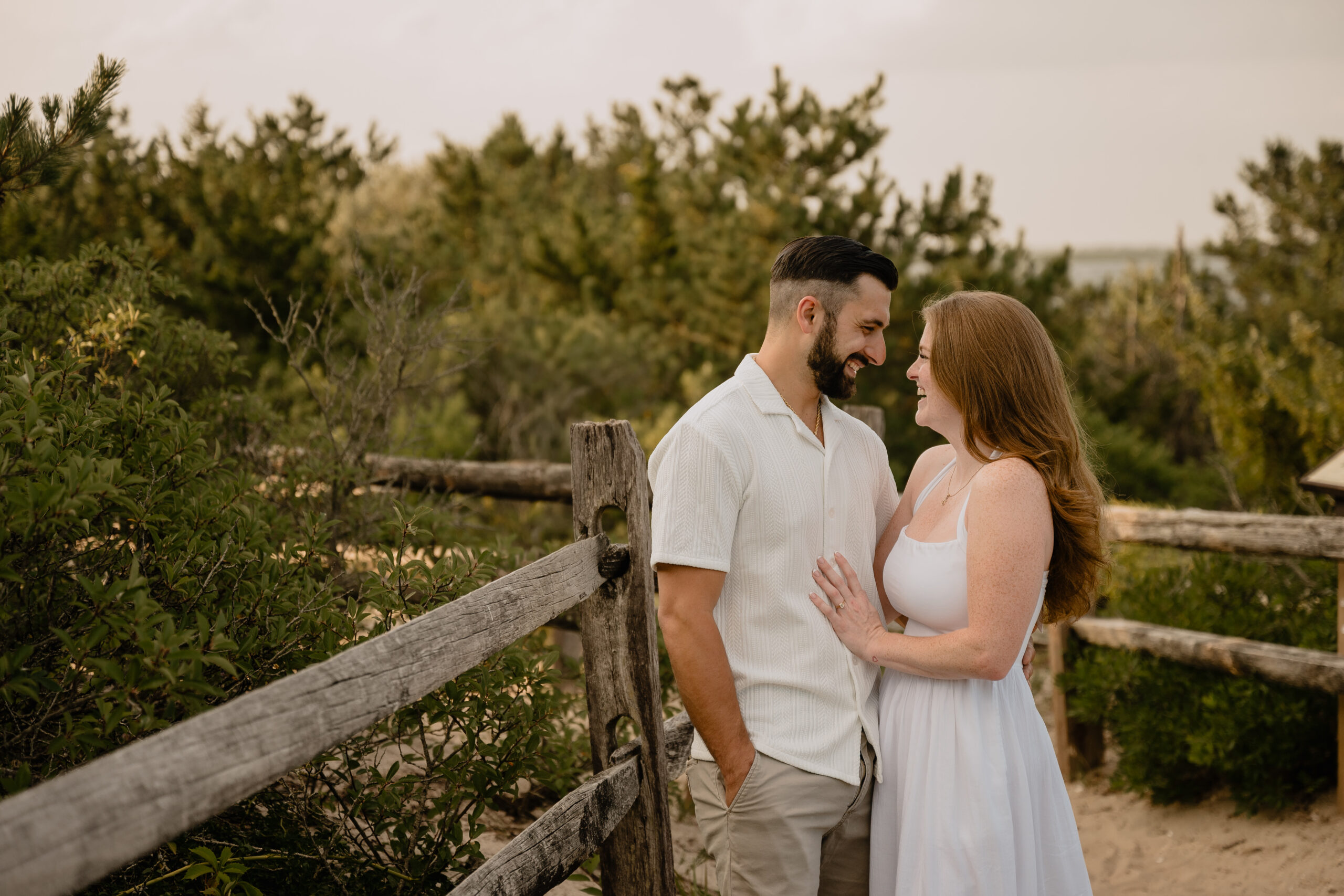 Couple laughing during their Engagement Session at Barnegat Lighthouse