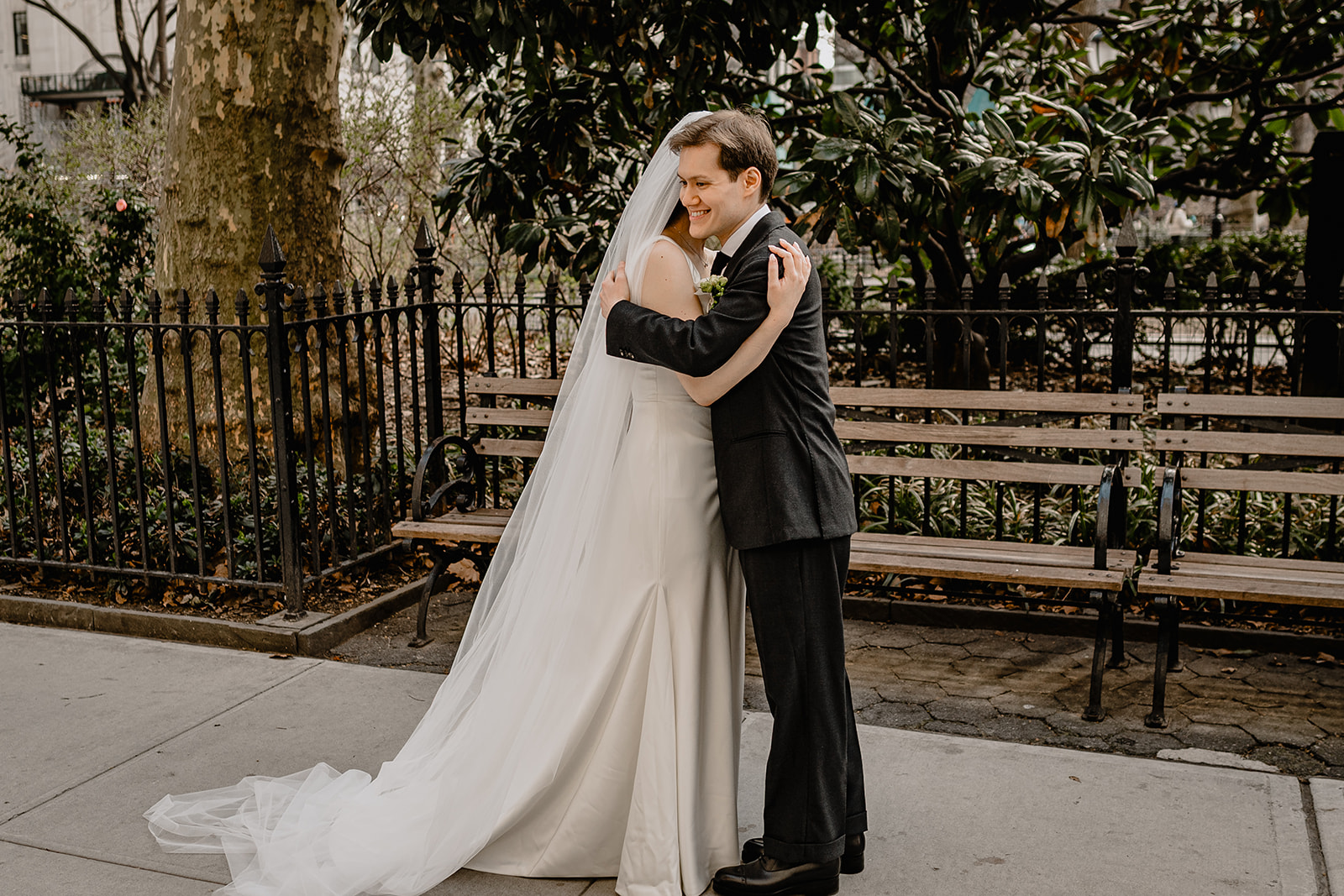 Couple hugging by the park before their Wedding at Blackbarn.