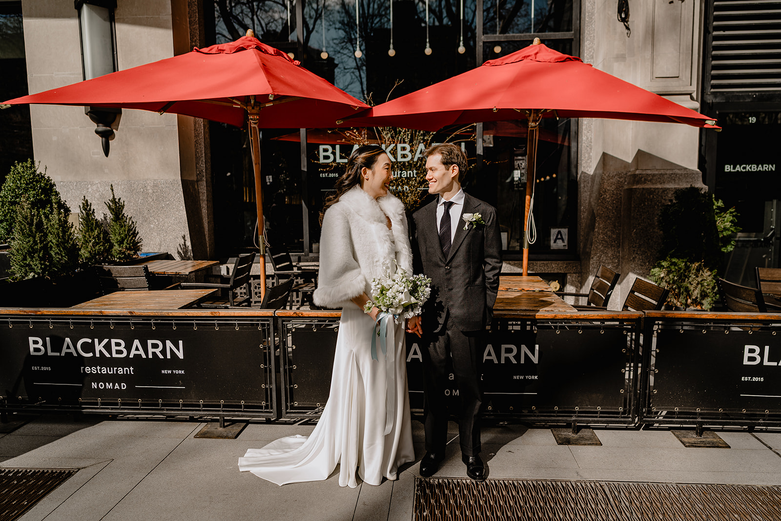Couple in front of the restaurant before their Wedding at Blackbarn.