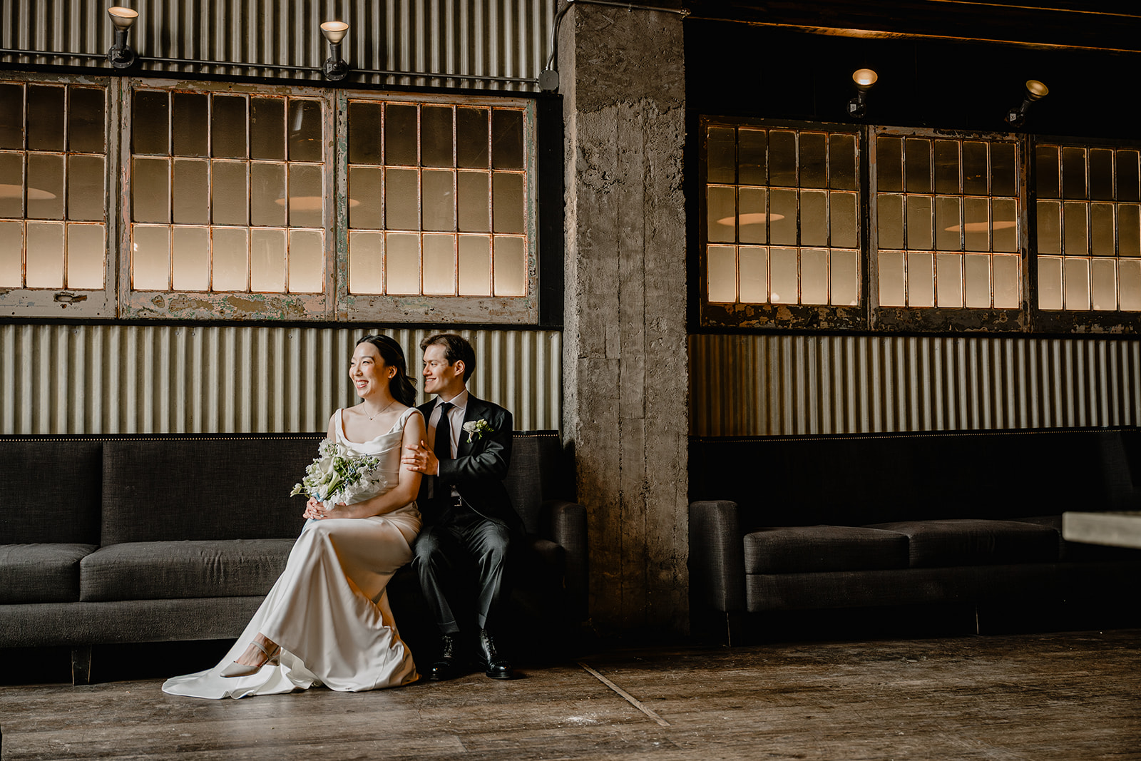 Couple sitting in a couch before their Wedding at Blackbarn.