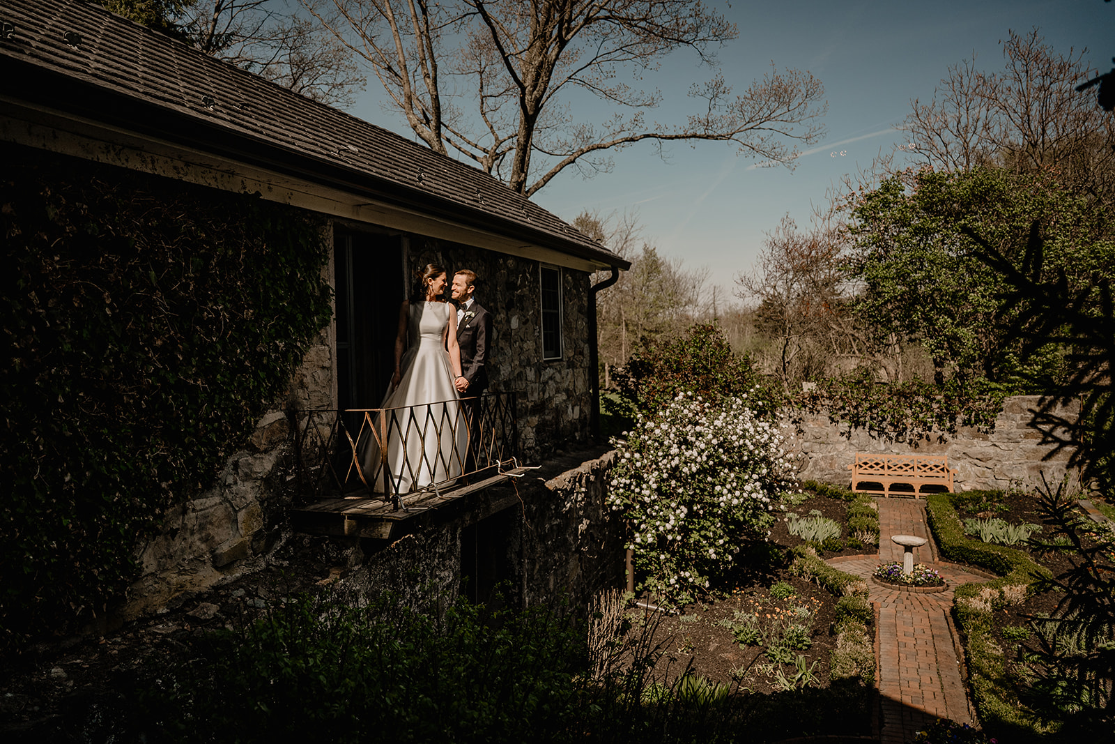 Couple by the balcony before their beautiful wedding at Crossed Keys Estate.