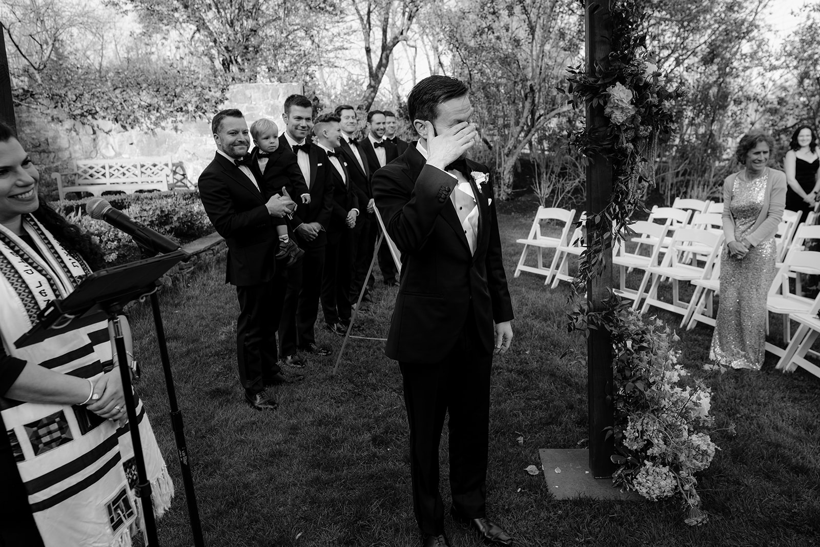 Groom crying while waiting down the aisle during their beautiful wedding at Crossed Keys Estate.