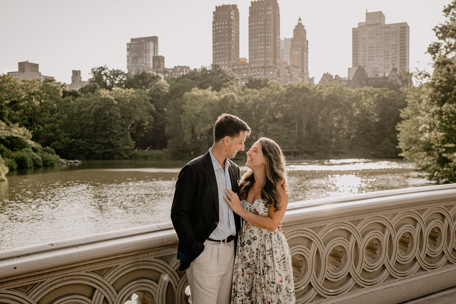 Couple by the bridge during Engagement Session in Central Park.