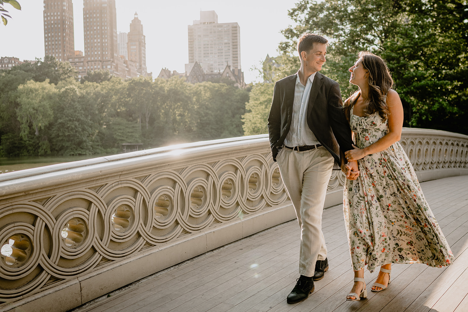 Couple by the bridge during Engagement Session in Central Park.