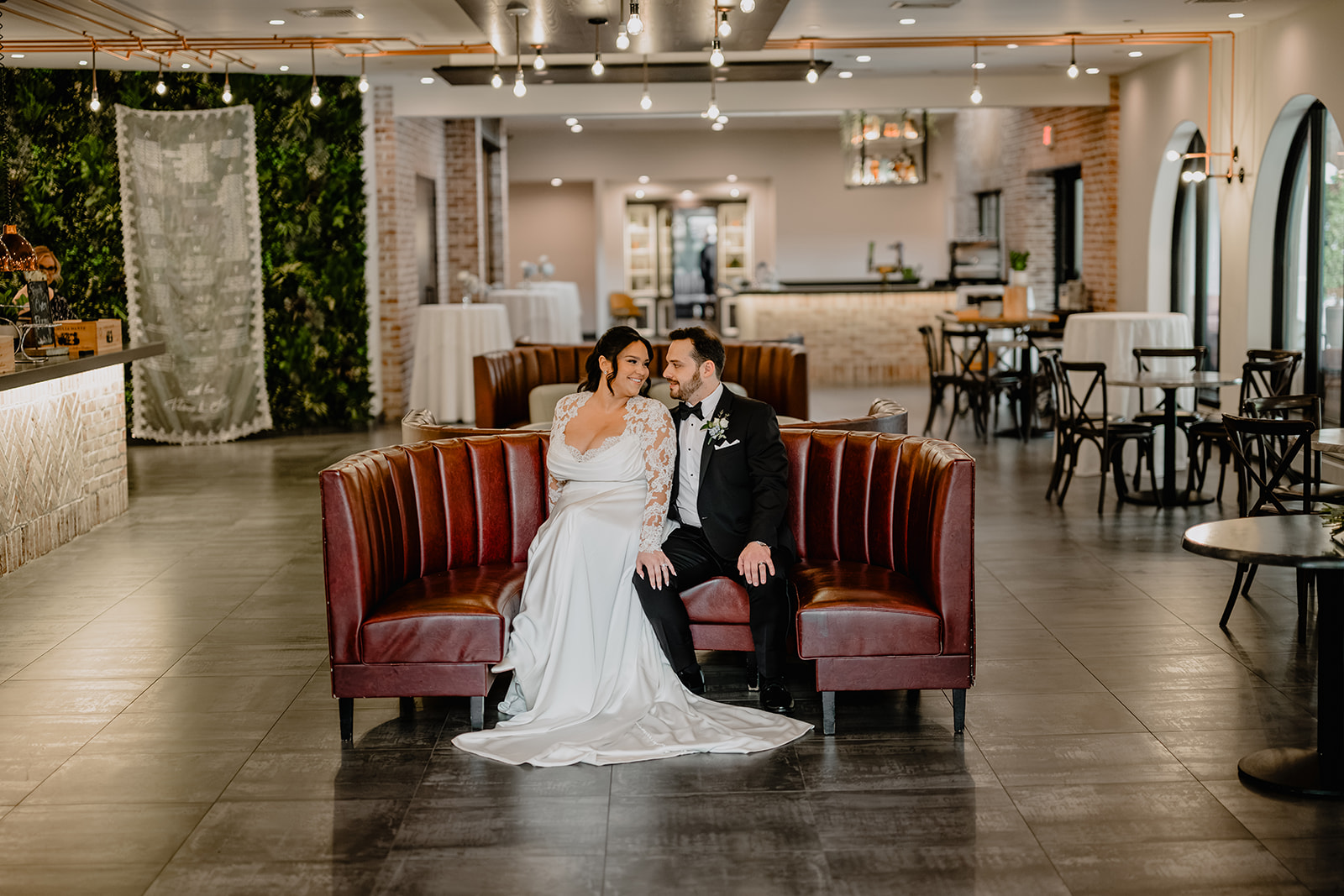 Couple sitting in a couch before their Beautiful Wedding at Perona Farms Refinery